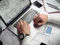 post_big/man_checking_blueprint_on_laptop.jpg