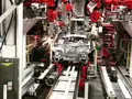 Роботы собирают Tesla Model 3