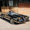 Adam West outside the Batmobile