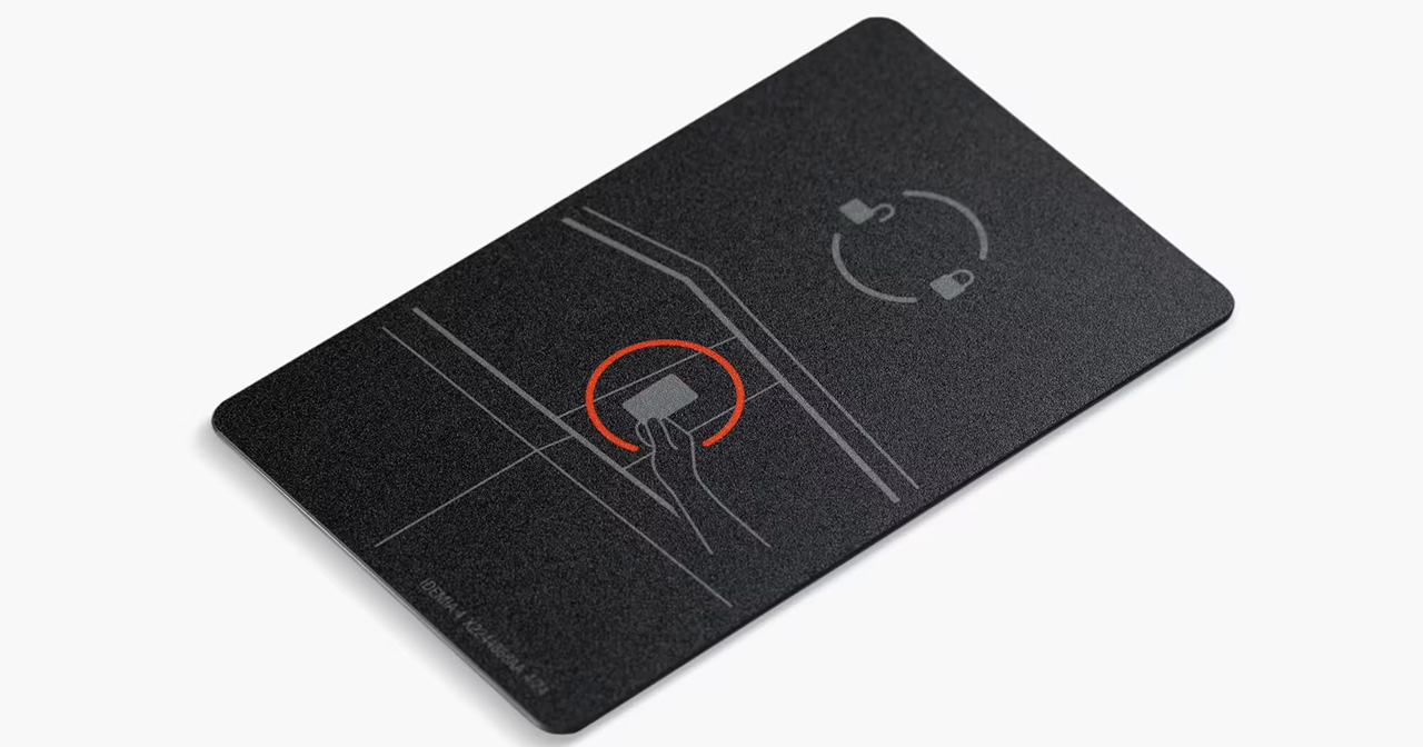Metal Tesla key card in your hand